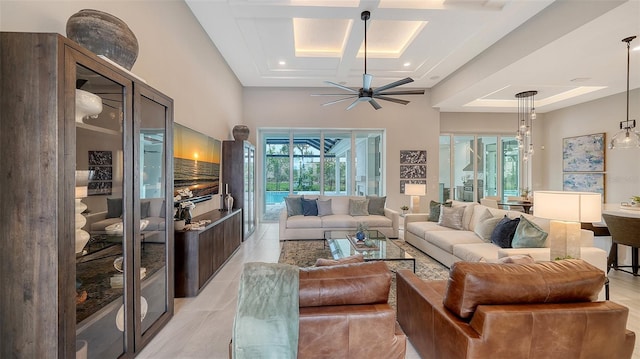 8348 Catamaran Cir, Lakewood Ranch, FL 34202 - living room with a ceiling fan, recessed lighting, light tile patterned floors, a raised ceiling, and a high ceiling