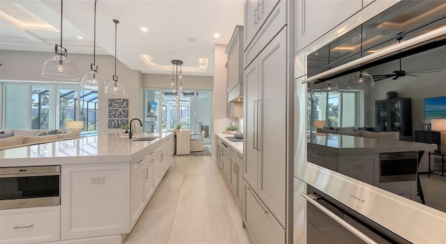 8348 Catamaran Cir, Lakewood Ranch, FL 34202 - kitchen with a sink, open floor plan, and plenty of natural light