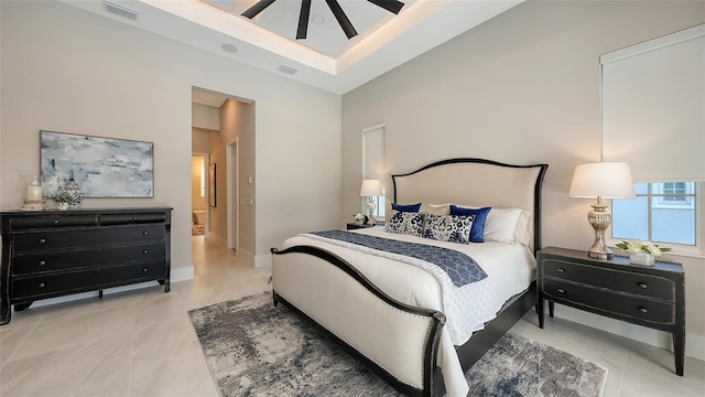 8348 Catamaran Cir, Lakewood Ranch, FL 34202 - bedroom featuring tile patterned floors, visible vents, baseboards, and a high ceiling