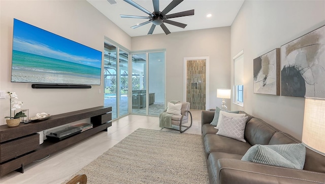 8348 Catamaran Cir, Lakewood Ranch, FL 34202 - living room with light tile patterned flooring, visible vents, and a ceiling fan