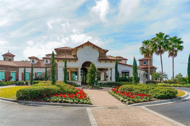 8348 Catamaran Cir, Lakewood Ranch, FL 34202 - mediterranean / spanish house with stucco siding, a tile roof, and decorative driveway