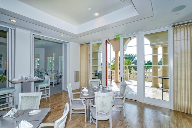 8348 Catamaran Cir, Lakewood Ranch, FL 34202 - dining space featuring a raised ceiling and wood finished floors