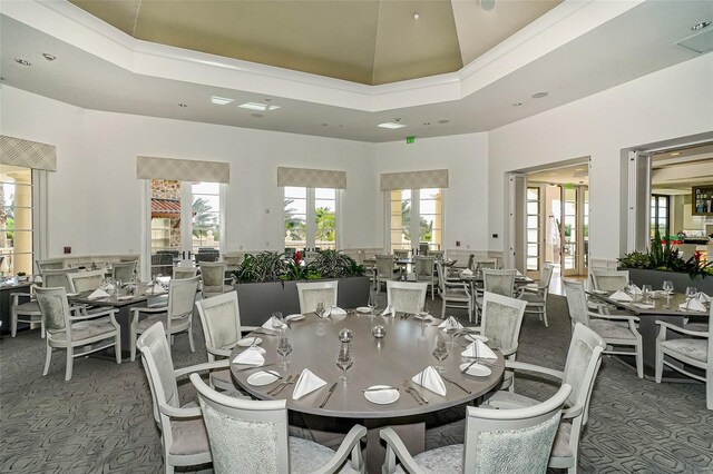 8348 Catamaran Cir, Lakewood Ranch, FL 34202 - carpeted dining area with a tray ceiling, a high ceiling, and recessed lighting