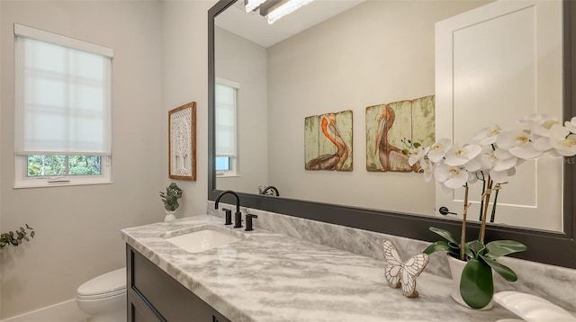 8348 Catamaran Cir, Lakewood Ranch, FL 34202 - bathroom featuring toilet, baseboards, and vanity