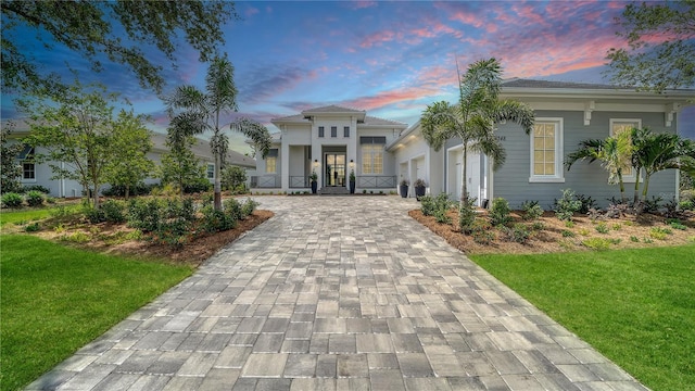 8348 Catamaran Cir, Lakewood Ranch, FL 34202 - view of front of home featuring a yard and decorative driveway