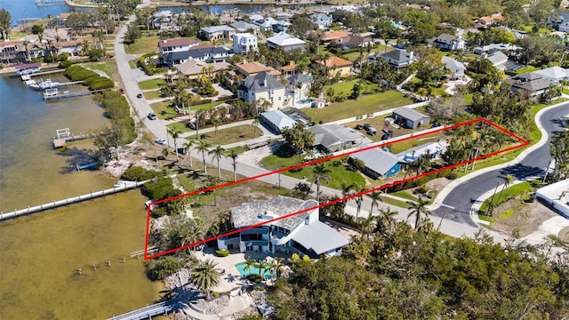 aerial view with a residential view and a water view