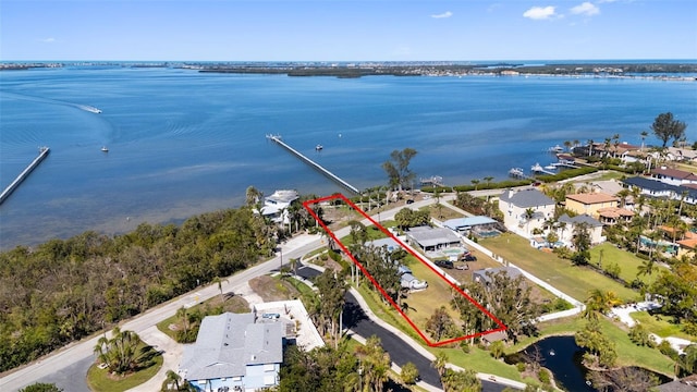 birds eye view of property with a residential view and a water view