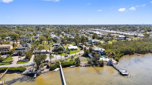 birds eye view of property with a residential view and a water view