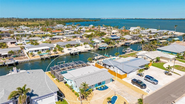 aerial view featuring a residential view and a water view