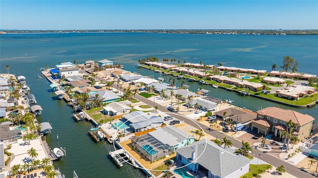 drone / aerial view with a residential view and a water view