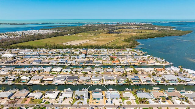 birds eye view of property with a water view and a residential view