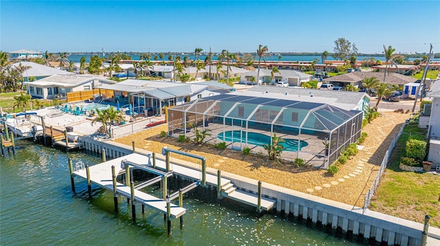 birds eye view of property featuring a residential view and a water view