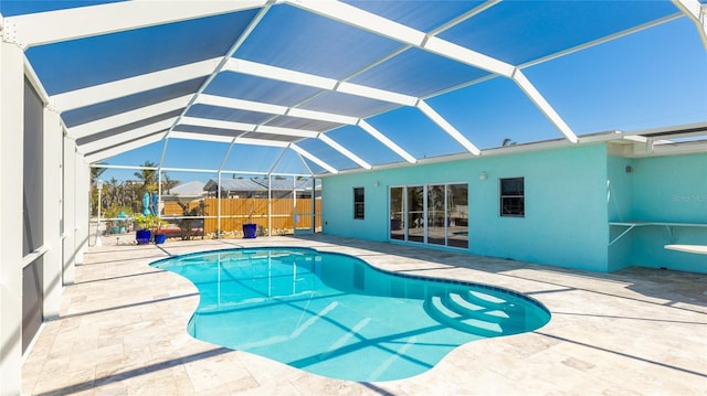 view of pool with a patio area, a fenced in pool, a lanai, and fence