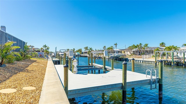 dock area featuring a residential view, a water view, boat lift, and a lanai