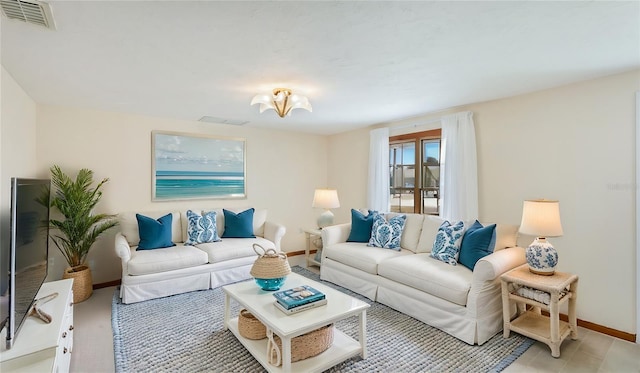 living room featuring visible vents and baseboards