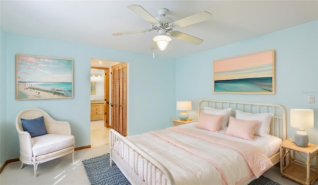 bedroom with ceiling fan, a closet, and ensuite bath