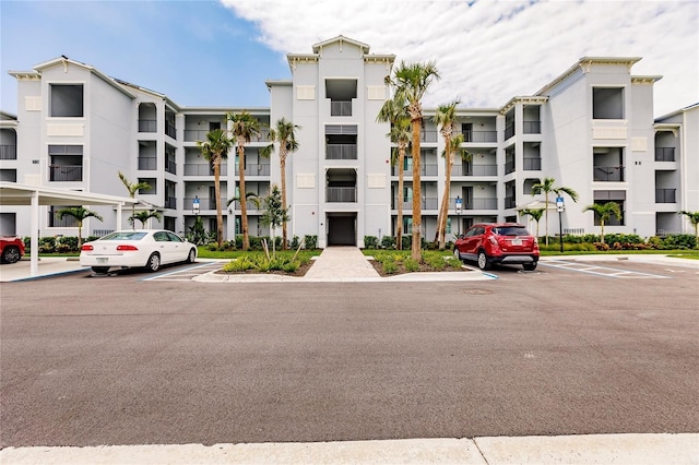 view of property with uncovered parking