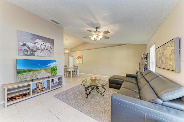 1127 133rd St E, Bradenton, FL 34212 - living room featuring vaulted ceiling, a ceiling fan, a textured ceiling, tile patterned flooring, and visible vents