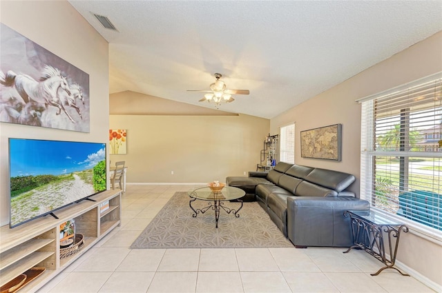 1127 133rd St E, Bradenton, FL 34212 - living room with baseboards, lofted ceiling, a ceiling fan, and light tile patterned floors