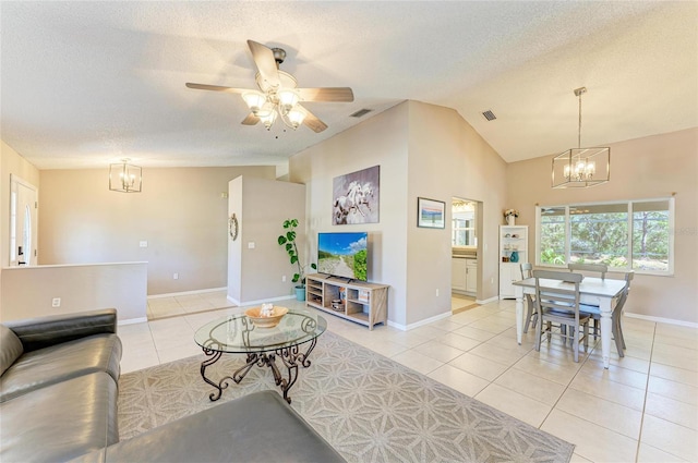 1127 133rd St E, Bradenton, FL 34212 - living area with lofted ceiling, visible vents, and light tile patterned floors