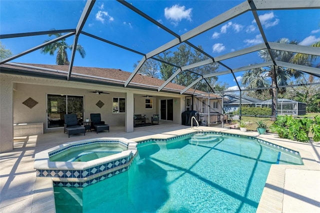 1127 133rd St E, Bradenton, FL 34212 - view of swimming pool featuring a pool with connected hot tub, area for grilling, a lanai, a patio, and a ceiling fan
