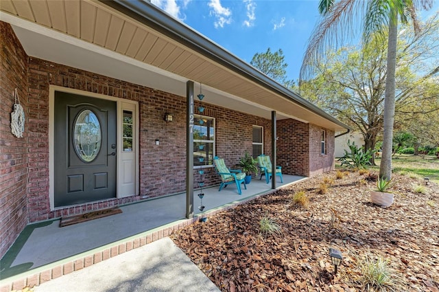 1127 133rd St E, Bradenton, FL 34212 - property entrance with brick siding and a porch