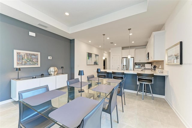 dining area featuring light tile patterned floors, visible vents, recessed lighting, and baseboards