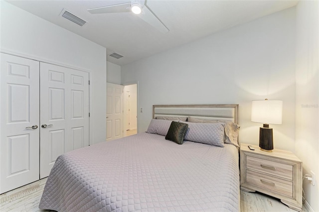 bedroom with visible vents, a closet, and ceiling fan