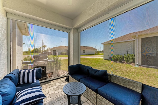 sunroom / solarium with a residential view