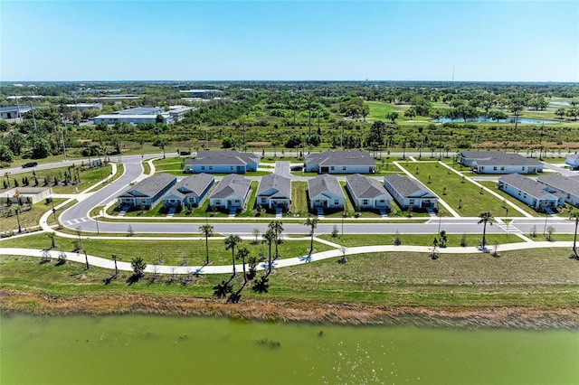 bird's eye view with a residential view and a water view