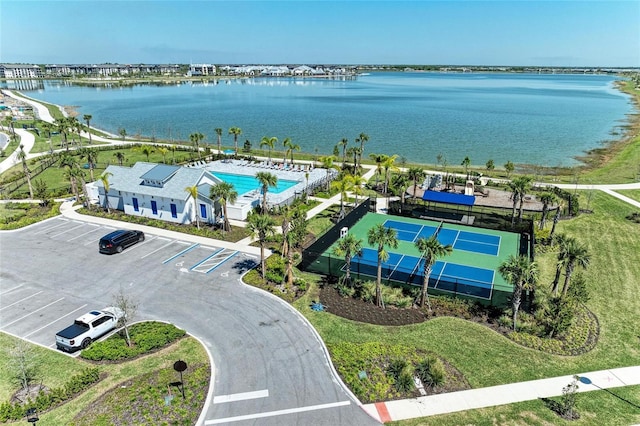 birds eye view of property with a water view