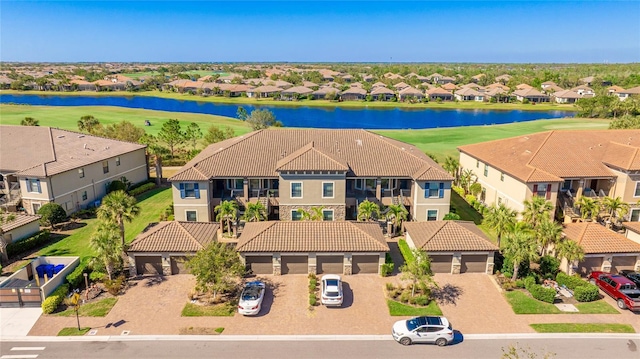 birds eye view of property featuring a residential view and a water view