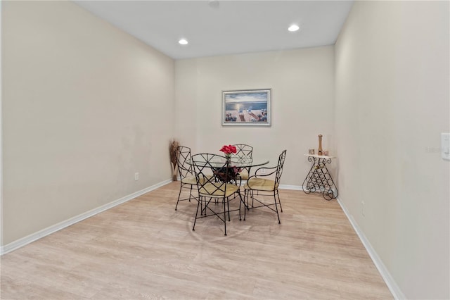 dining area with recessed lighting, baseboards, and wood finished floors