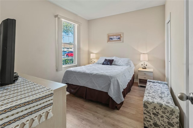 bedroom with light wood-style floors