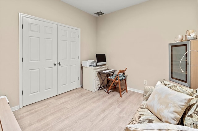 home office featuring visible vents, baseboards, and light wood-style floors