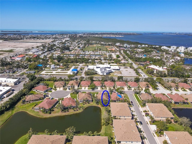 birds eye view of property featuring a water view and a residential view