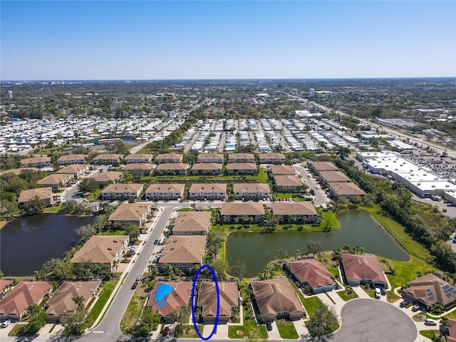 bird's eye view with a residential view and a water view