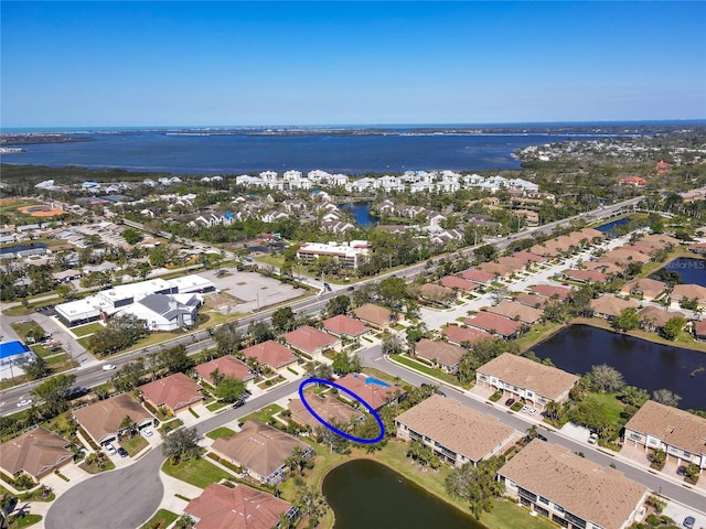 bird's eye view with a residential view and a water view