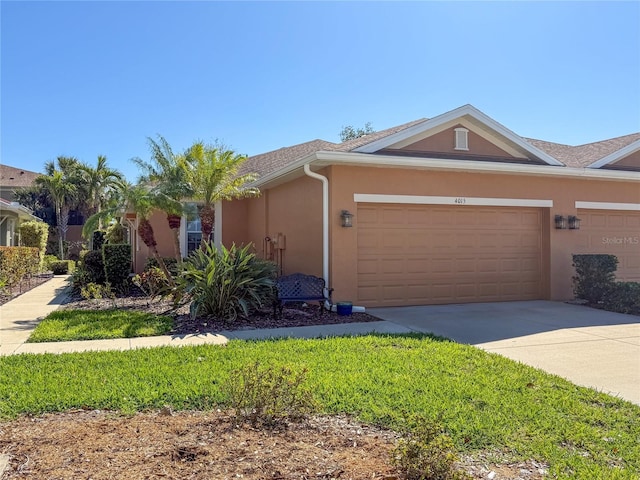 view of front of house featuring stucco siding, concrete driveway, and a garage