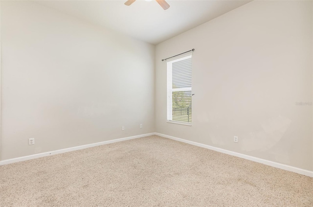 unfurnished room featuring baseboards, carpet, and ceiling fan