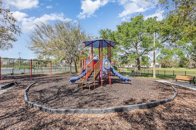 community jungle gym featuring fence