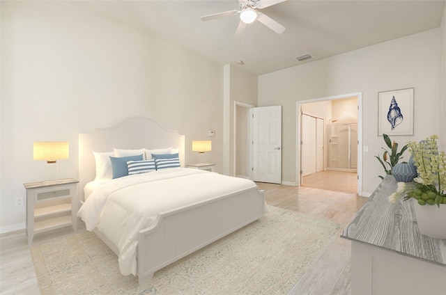 bedroom with a ceiling fan, baseboards, visible vents, ensuite bath, and light wood-type flooring