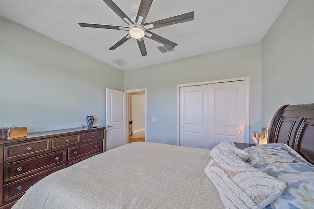 bedroom with a closet, visible vents, and ceiling fan