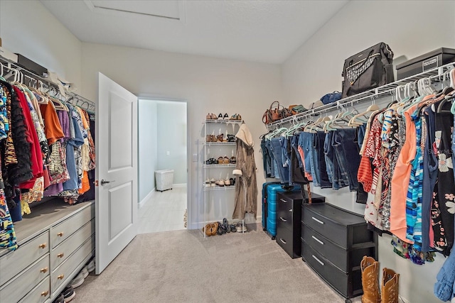 walk in closet featuring carpet