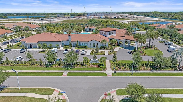 drone / aerial view with a residential view and a water view