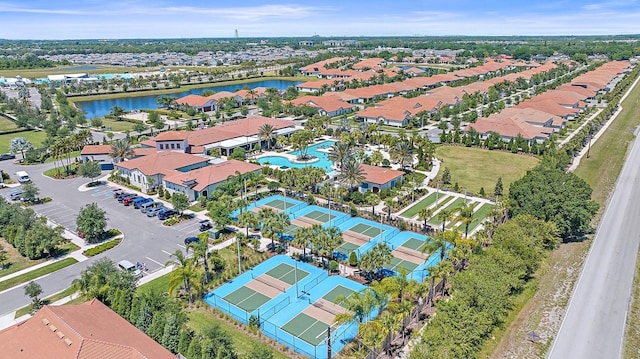 birds eye view of property with a residential view and a water view