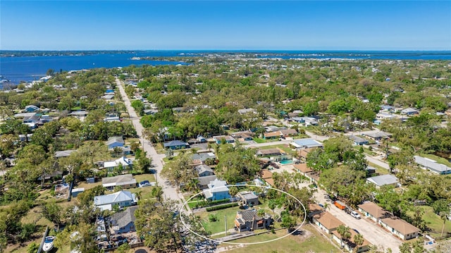 drone / aerial view featuring a residential view and a water view