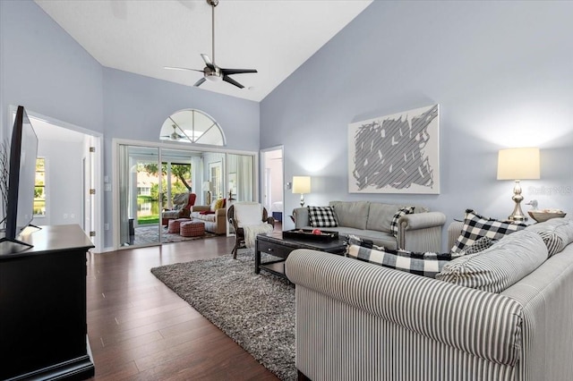 living room with ceiling fan, high vaulted ceiling, and wood finished floors