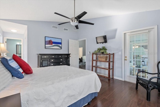 bedroom with vaulted ceiling, dark wood-style floors, visible vents, and baseboards