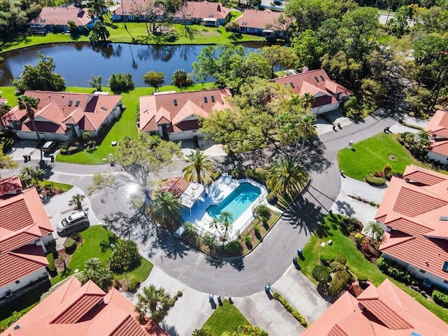 birds eye view of property featuring a residential view and a water view